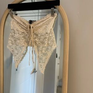 Cute nude top with a black mini skirt